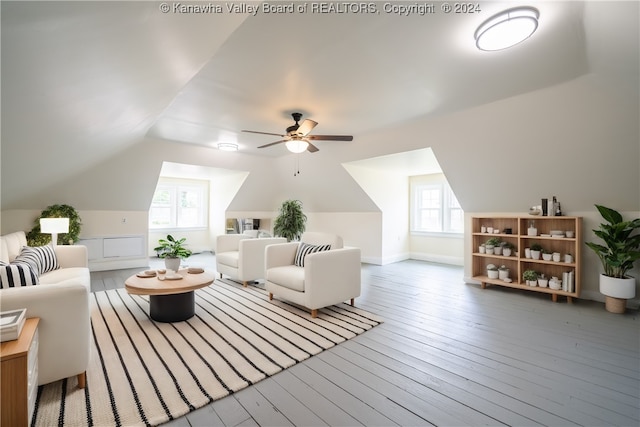 living room with plenty of natural light, ceiling fan, hardwood / wood-style floors, and lofted ceiling