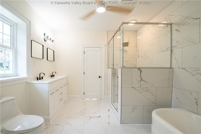 full bathroom featuring ceiling fan, plus walk in shower, vanity, and a healthy amount of sunlight