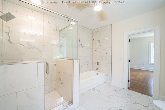 bathroom featuring hardwood / wood-style floors, shower with separate bathtub, and toilet