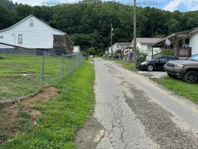 view of street featuring a wooded view