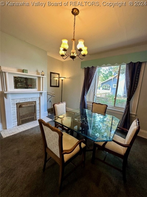 carpeted dining room featuring a chandelier