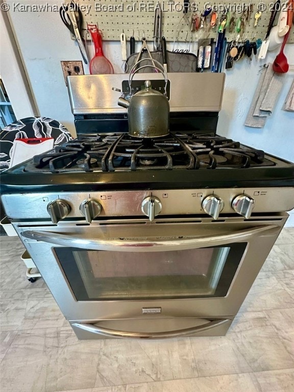 interior details featuring stainless steel range with gas cooktop