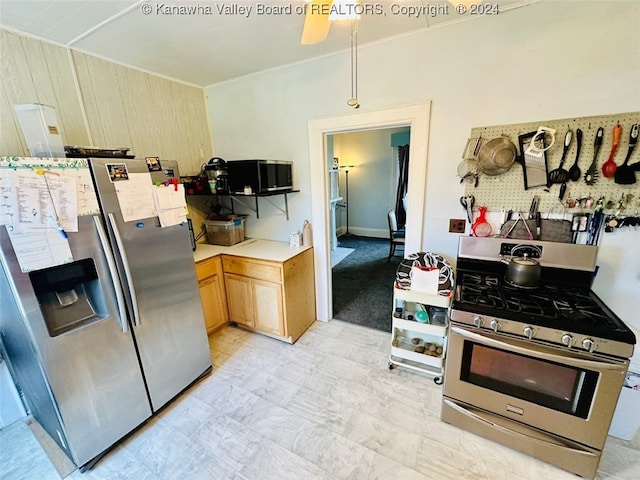 kitchen with light brown cabinetry and stainless steel appliances