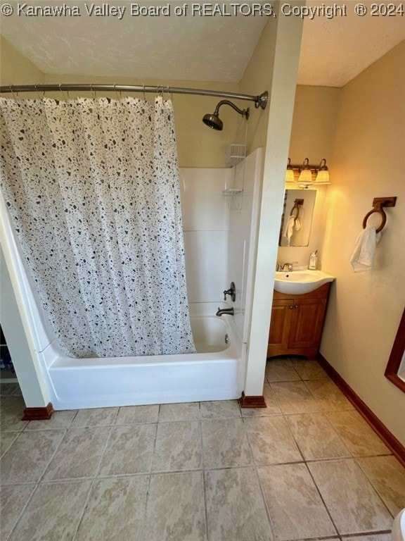 bathroom with vanity, tile patterned floors, and shower / bath combo with shower curtain