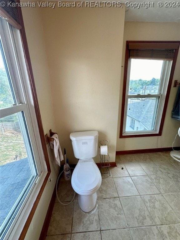 bathroom featuring tile patterned flooring and toilet