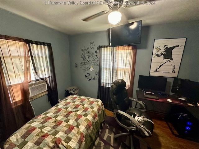 bedroom featuring ceiling fan and hardwood / wood-style floors