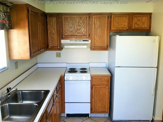 kitchen featuring ventilation hood, white appliances, light tile patterned floors, and sink