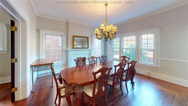 dining area with a chandelier, dark hardwood / wood-style flooring, and crown molding