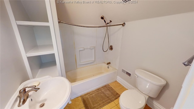 full bathroom featuring tile patterned flooring, washtub / shower combination, toilet, and sink