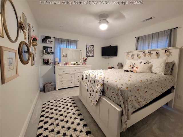 bedroom featuring ceiling fan and light colored carpet