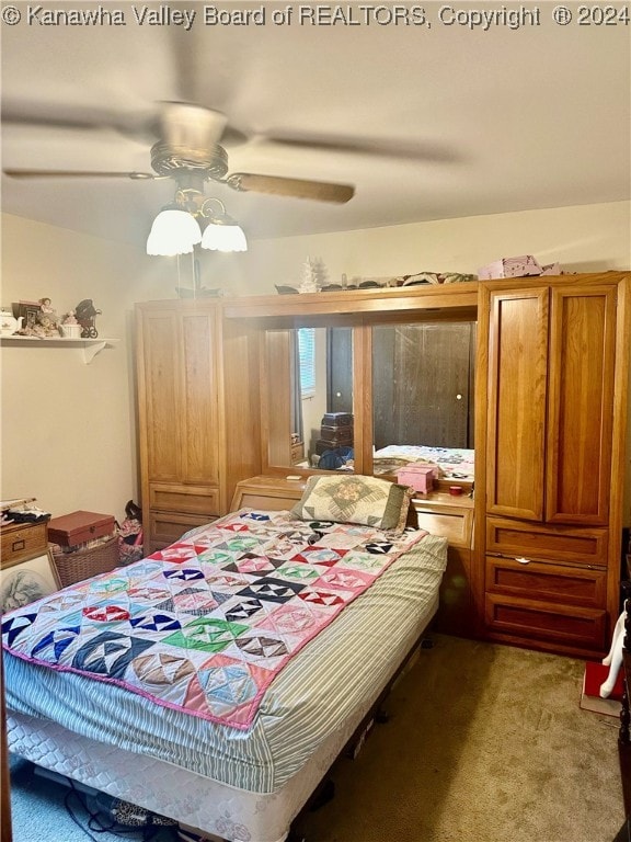 bedroom featuring ceiling fan and carpet floors