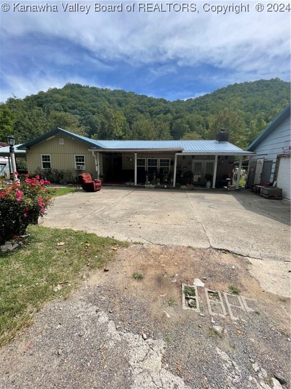 exterior space with a carport