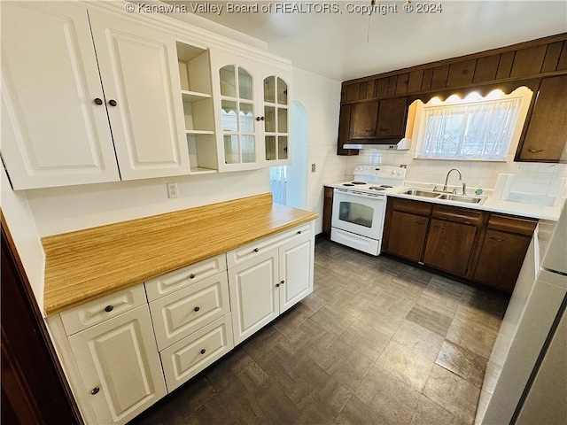 kitchen featuring white cabinetry, sink, backsplash, and white electric range