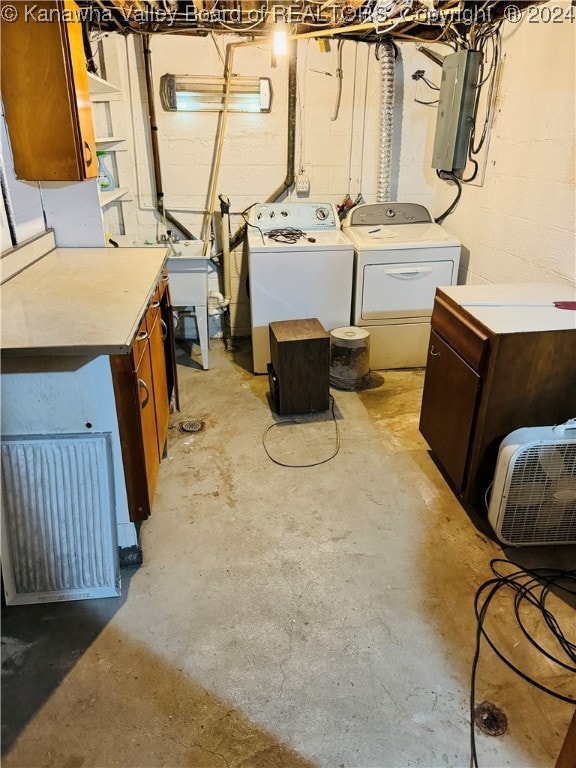 washroom featuring electric panel and independent washer and dryer