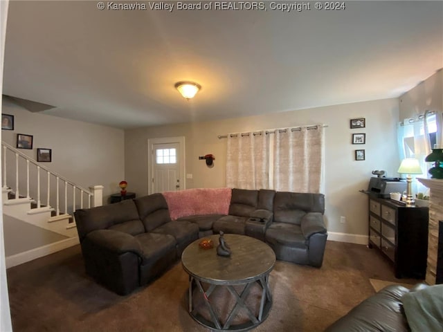 living room with dark carpet