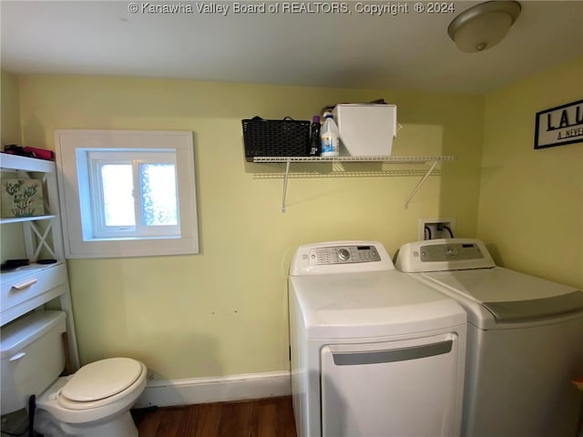 clothes washing area featuring dark hardwood / wood-style floors and independent washer and dryer