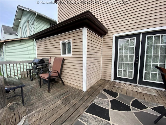 wooden terrace featuring grilling area