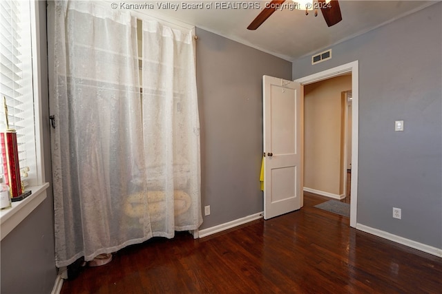 interior space with ceiling fan and dark hardwood / wood-style flooring