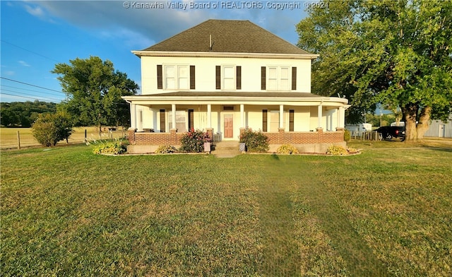 view of front of house featuring a front lawn and covered porch