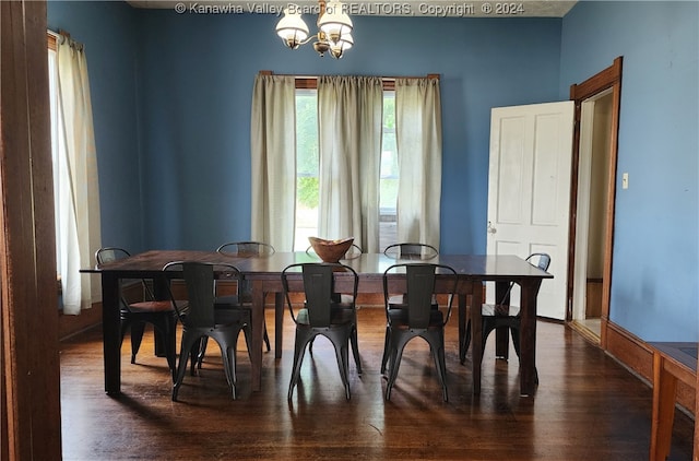 dining room with a wealth of natural light, a chandelier, and dark hardwood / wood-style flooring