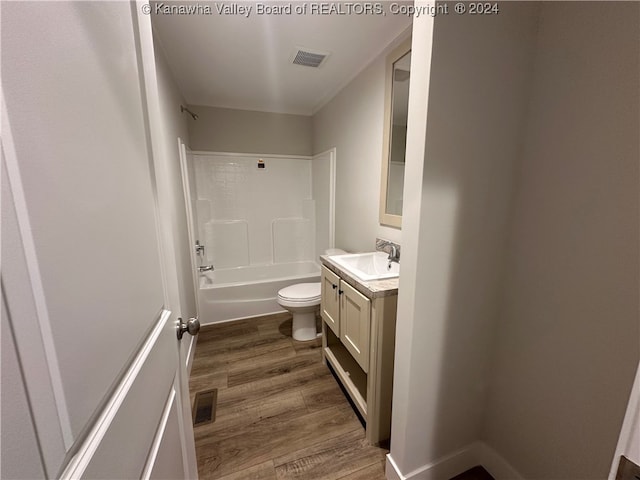 full bathroom featuring vanity, toilet, shower / bathtub combination, and wood-type flooring