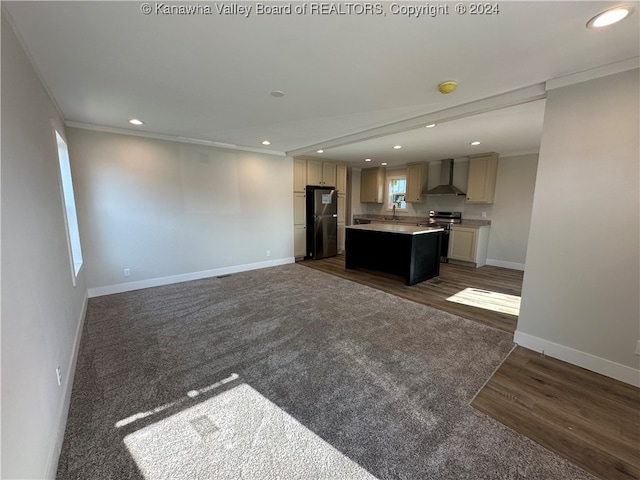 unfurnished living room featuring ornamental molding, dark hardwood / wood-style flooring, and sink