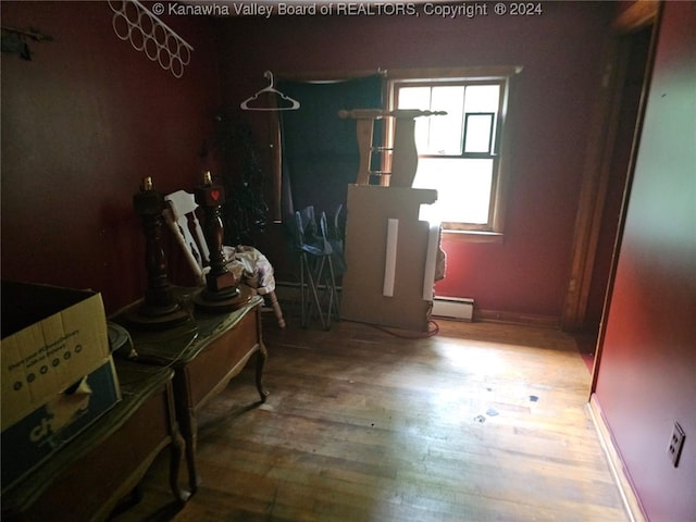 miscellaneous room with hardwood / wood-style floors and a baseboard radiator