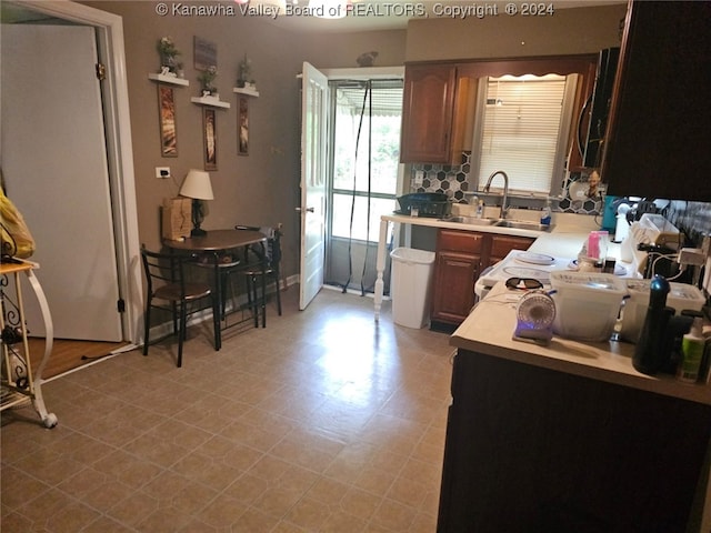 kitchen featuring sink and tasteful backsplash