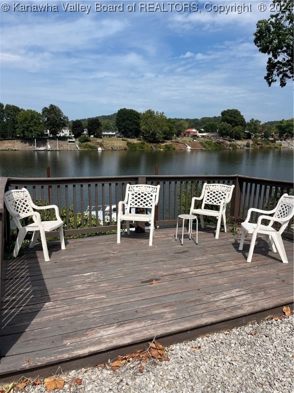 wooden terrace with a water view