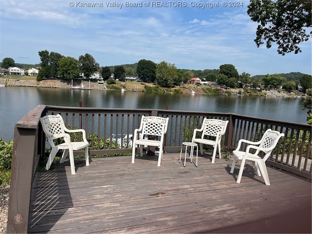 wooden terrace with a water view