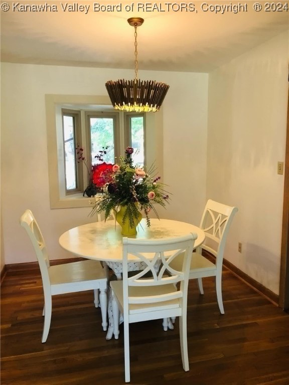 dining space featuring dark hardwood / wood-style flooring