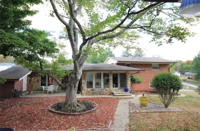 rear view of house featuring a patio