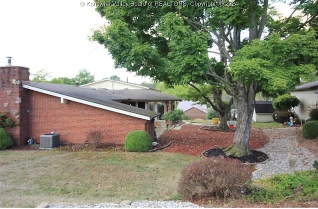 view of yard with central AC