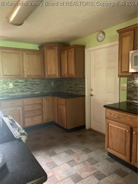 kitchen with tasteful backsplash