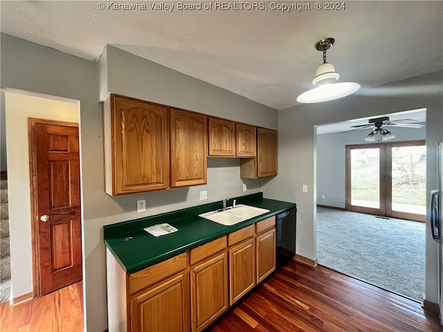 kitchen with ceiling fan, sink, a textured ceiling, dishwasher, and dark hardwood / wood-style flooring