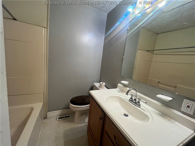 full bathroom featuring  shower combination, vanity, and toilet