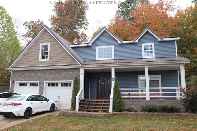 view of front facade featuring a porch and a garage