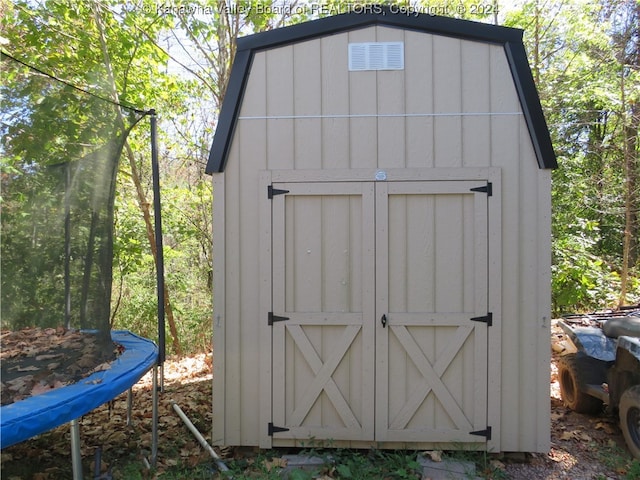 view of outbuilding featuring a trampoline