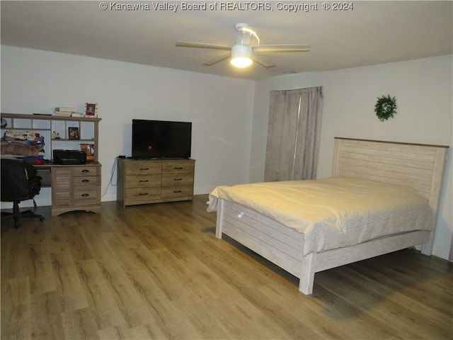 bedroom featuring ceiling fan and hardwood / wood-style floors