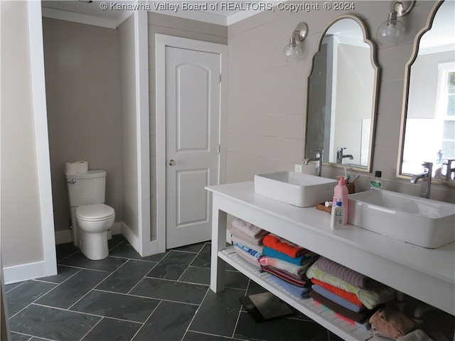 bathroom with ornamental molding, vanity, tile patterned flooring, and toilet