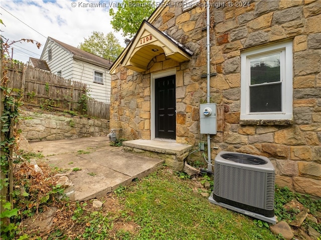 doorway to property with cooling unit