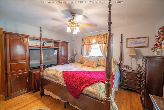 bedroom featuring ceiling fan and light hardwood / wood-style flooring