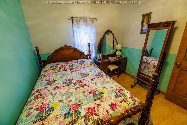 bedroom with light hardwood / wood-style floors