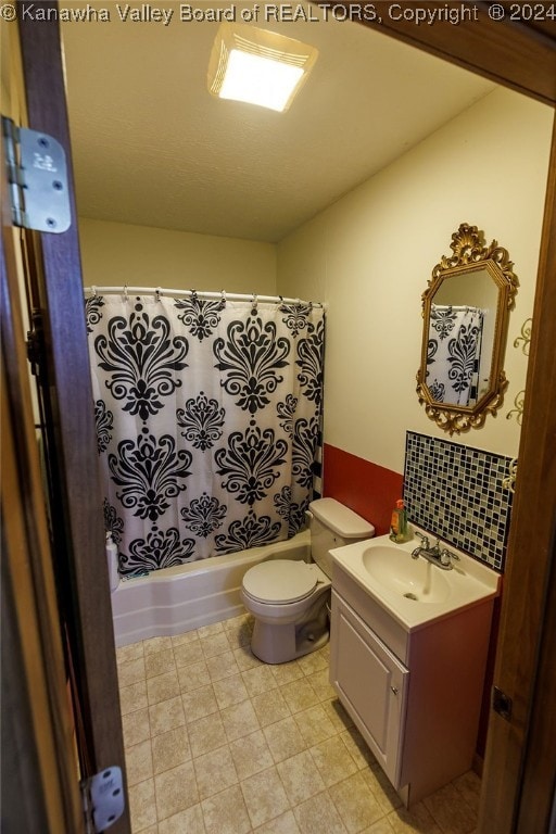 full bathroom featuring vanity, toilet, shower / tub combo, and decorative backsplash