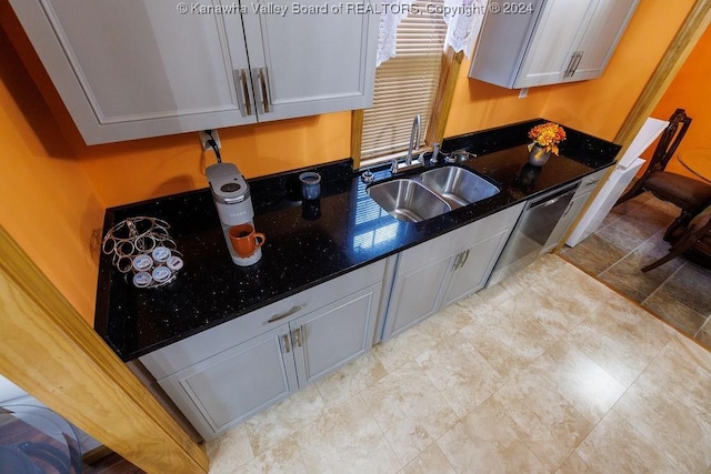 kitchen featuring gray cabinets, sink, and stainless steel dishwasher