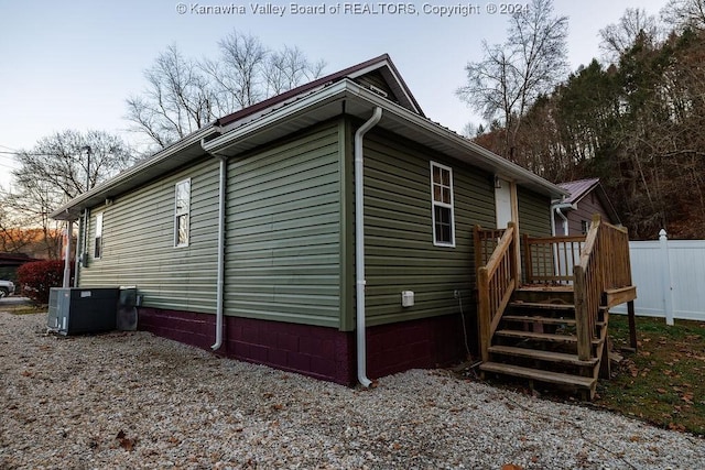 view of property exterior featuring central AC