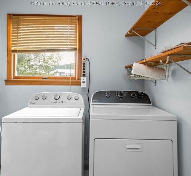 washroom featuring washer and clothes dryer