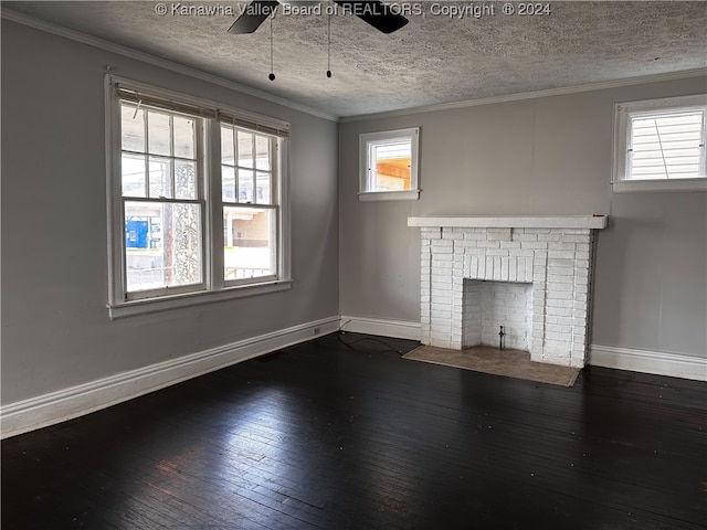 unfurnished living room with a textured ceiling, ornamental molding, dark hardwood / wood-style floors, and ceiling fan