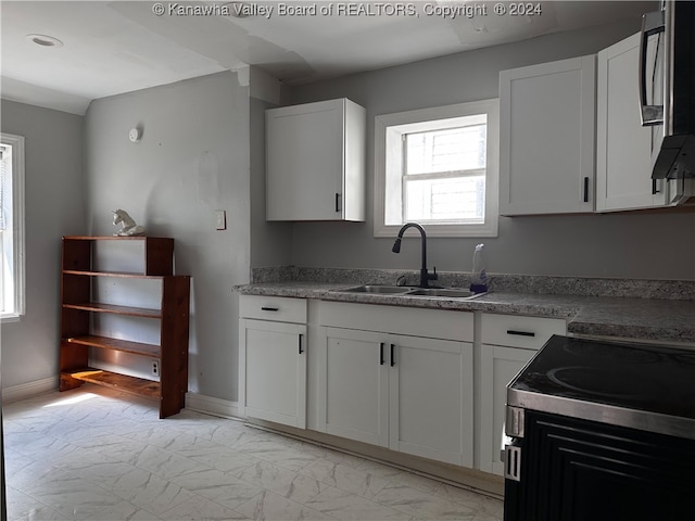 kitchen with sink and white cabinetry