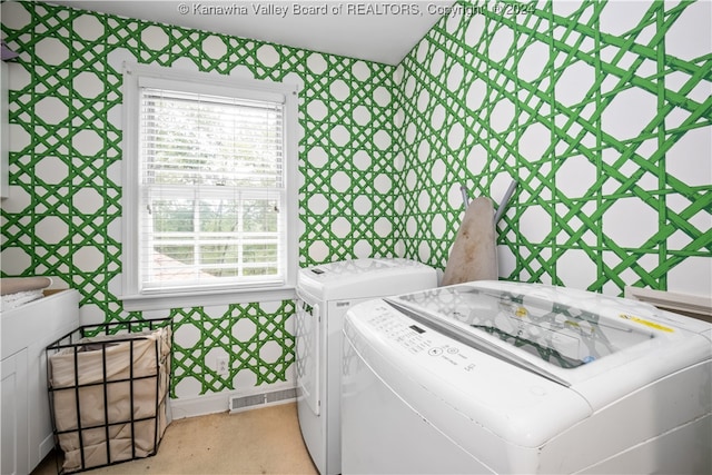 laundry area featuring washing machine and clothes dryer